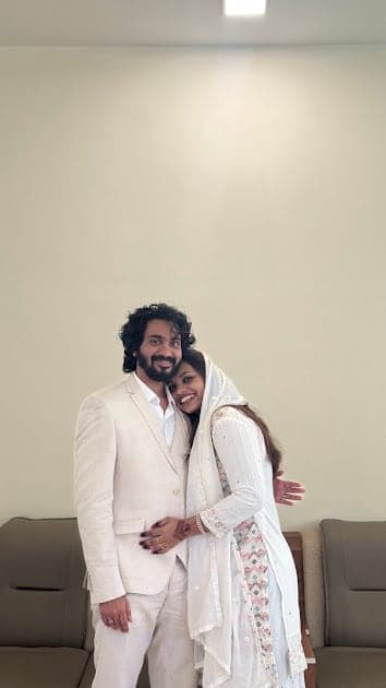 Nisham and Fazna, both in white, side by side